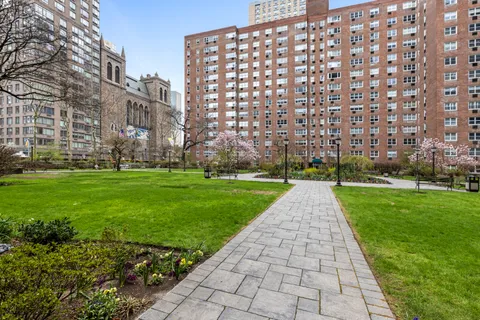 a view of a building with a yard