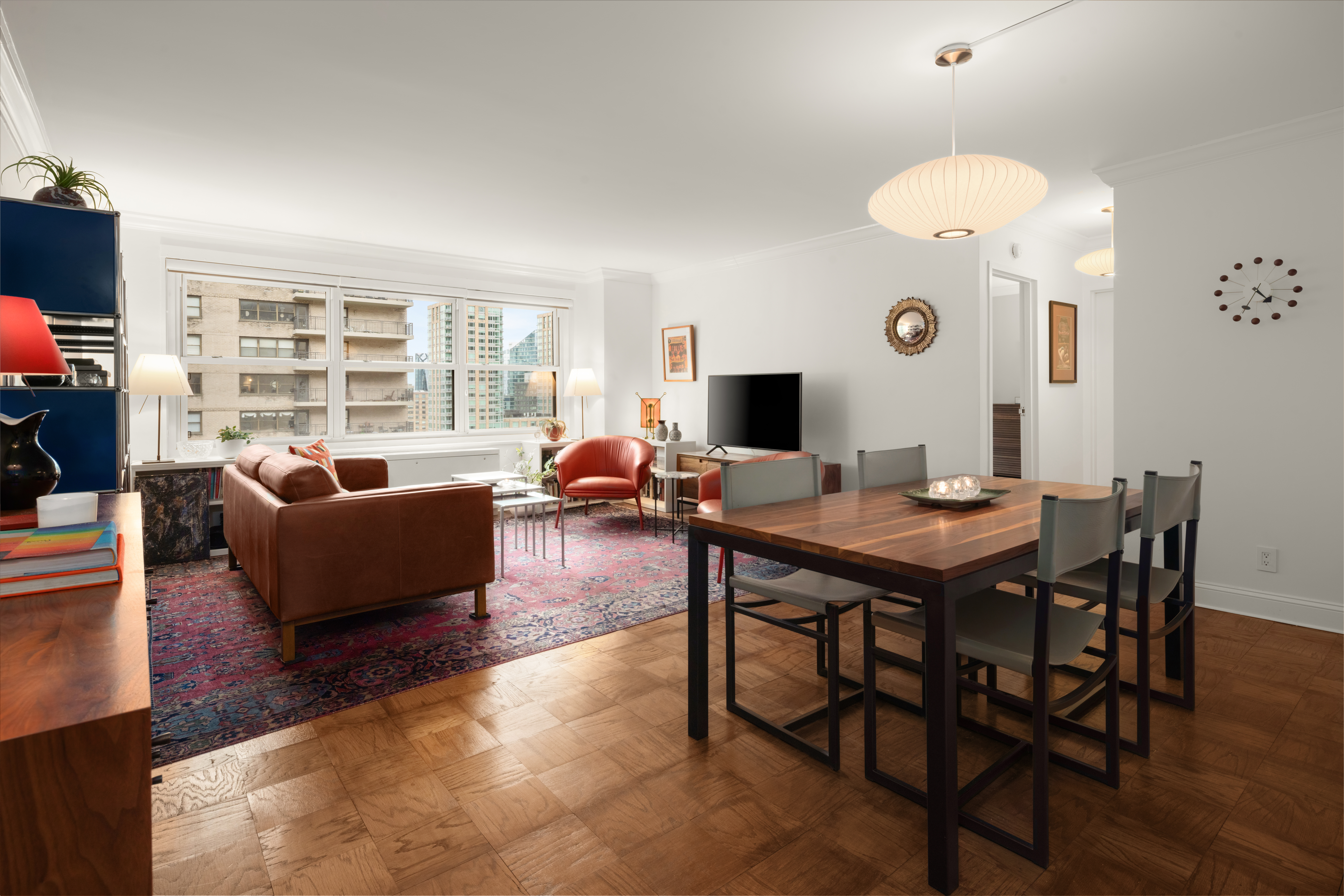 150 West End Avenue, Unit 24S Manhattan, NY 10023 - Photo 3 of 14 a living room with furniture kitchen view and a large window