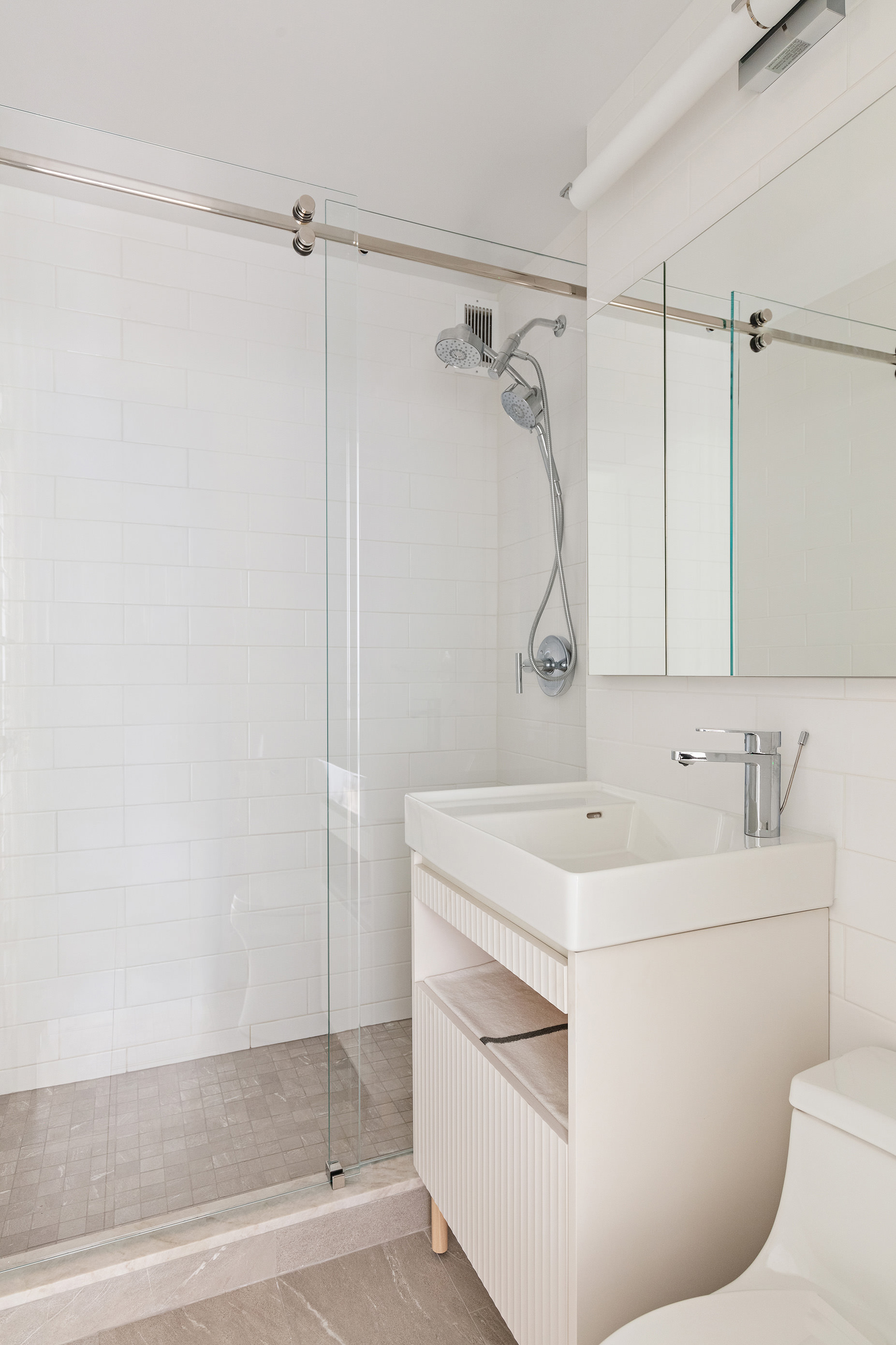 39 Gramercy Park North, Unit 9A Manhattan, NY 10010 - Photo 6 of 12 a bathroom with a sink a toilet and shower