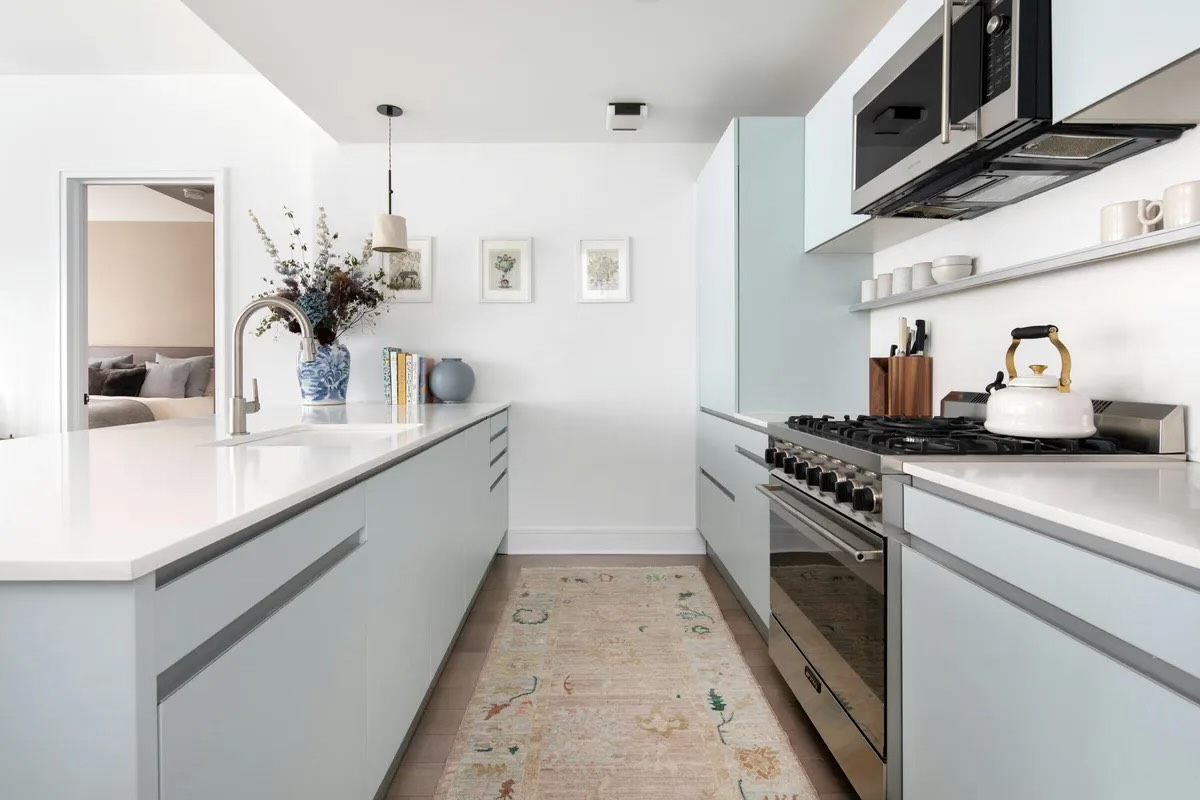 265 State Street, Unit 806 Brooklyn, NY 11201 - Photo 3 of 8 a kitchen with stainless steel appliances granite countertop a sink and stove top oven