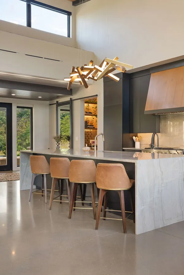 a kitchen with a refrigerator and a stove