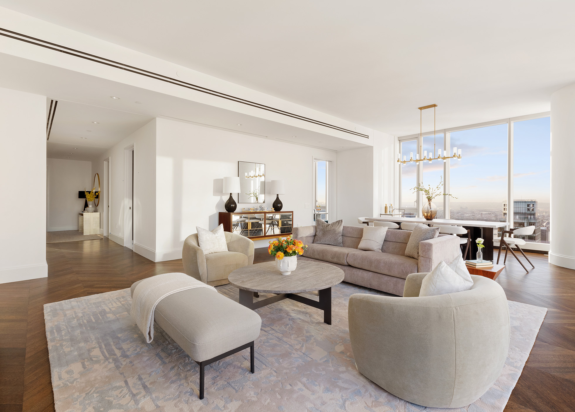 217 West 57th Street, Unit 60W Manhattan, NY 10019 - Photo 15 of 27 a living room with furniture and a wooden floor