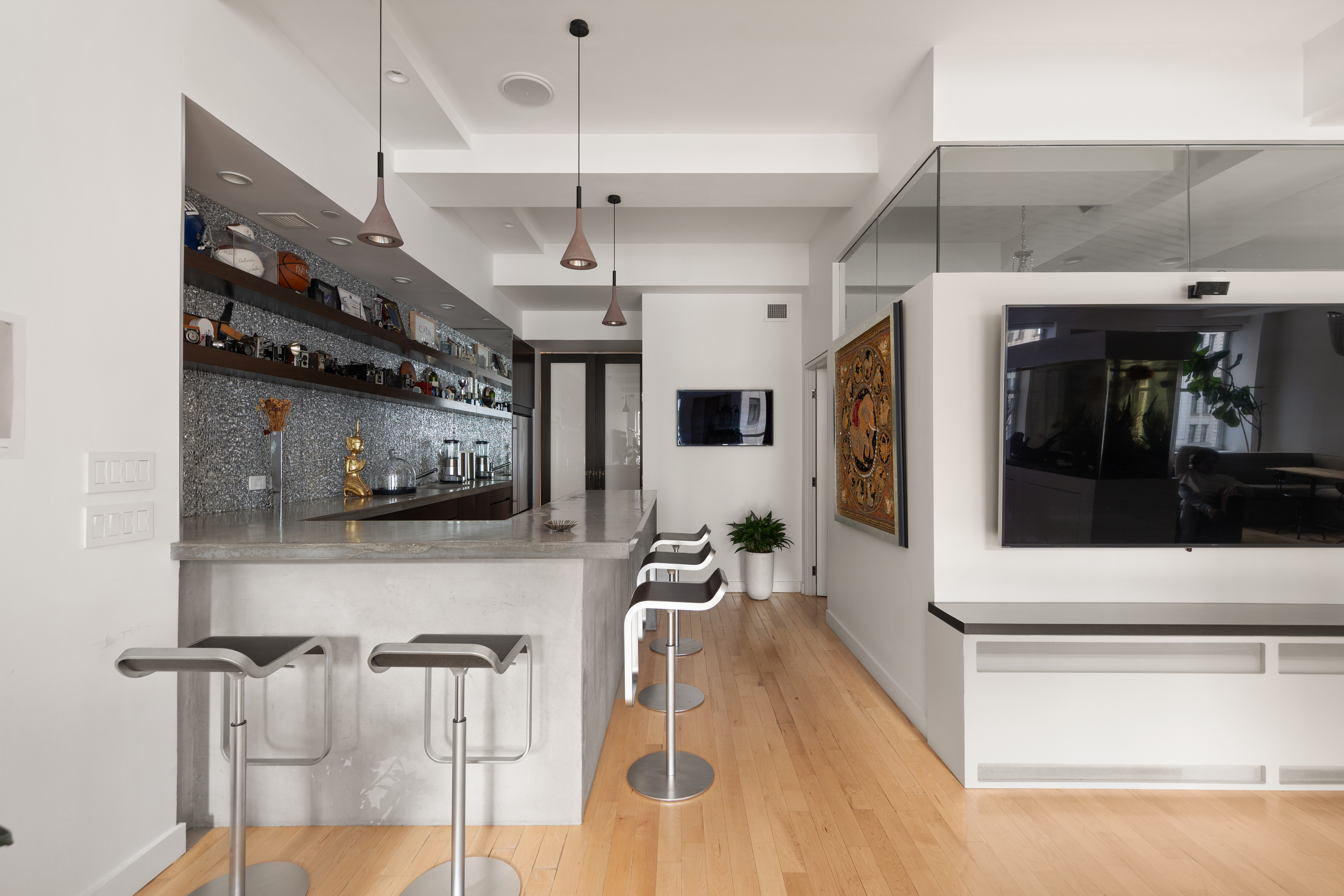 15 Broad Street, Unit 1006 Manhattan, NY 10005 - Photo 10 of 32 a living room with furniture and a flat screen tv