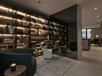 a living room with lots of furniture and clutter