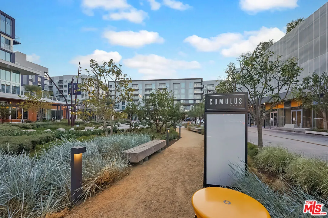 a view of water fountain with a big yard