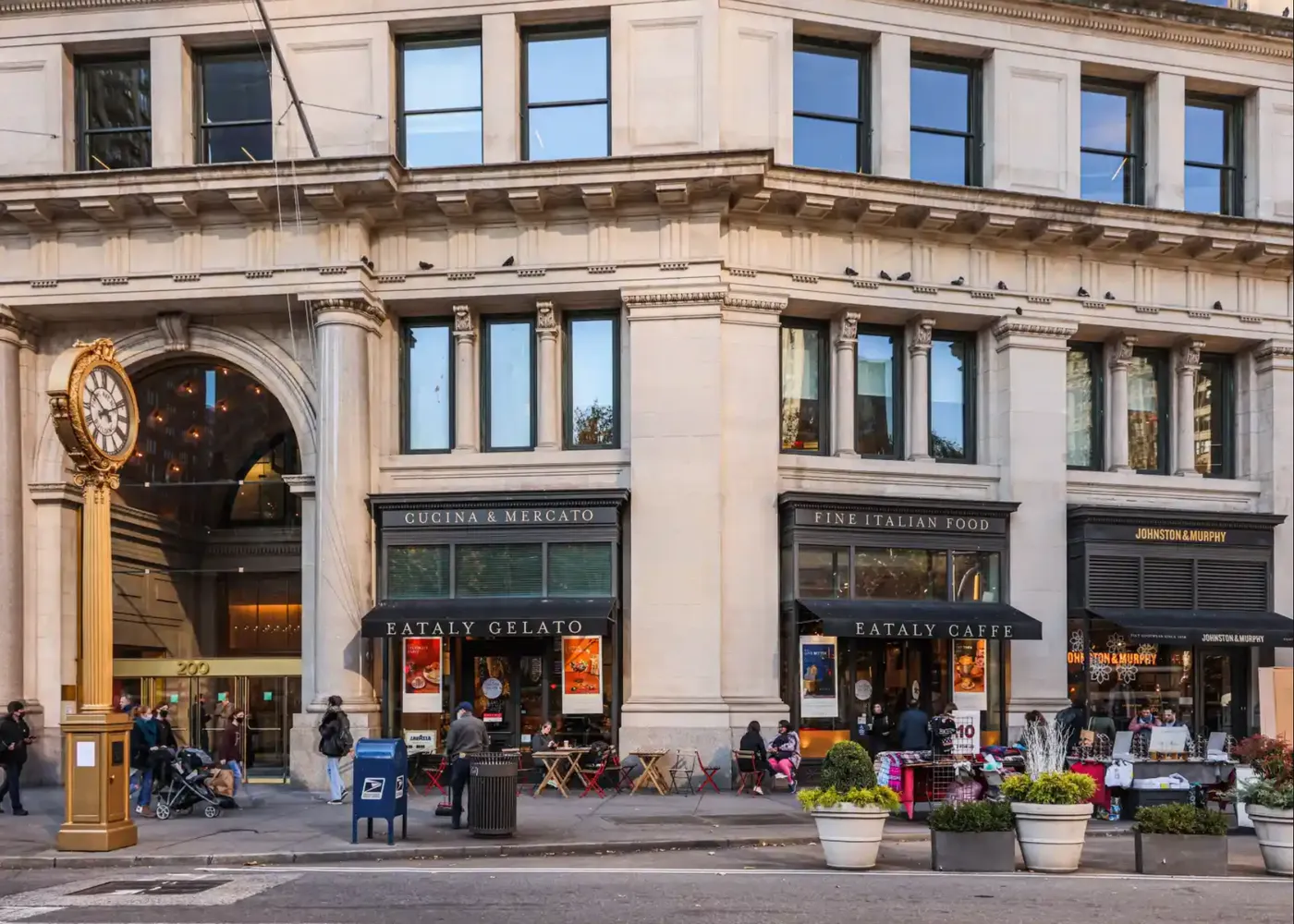 a city street filled with lots of tall buildings and cars