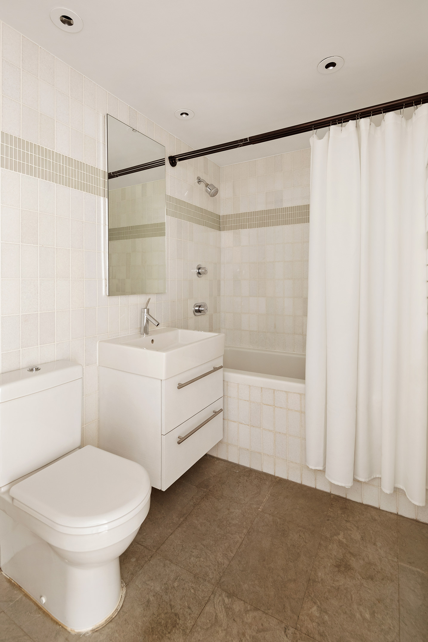 16 Warren Street, Unit 5 Manhattan, NY 10007 - Photo 12 of 18 a bathroom with a sink a toilet and shower