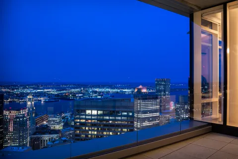 a view of a balcony with city view