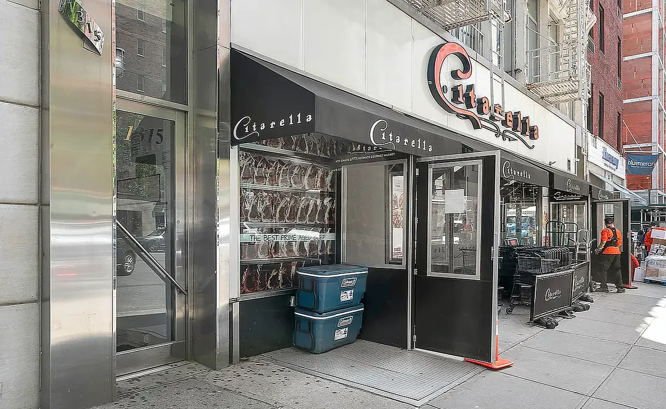 1313 3rd Avenue, Unit 3RN Manhattan, NY 10021 - Photo 6 of 7 a front view of a building with retail shops