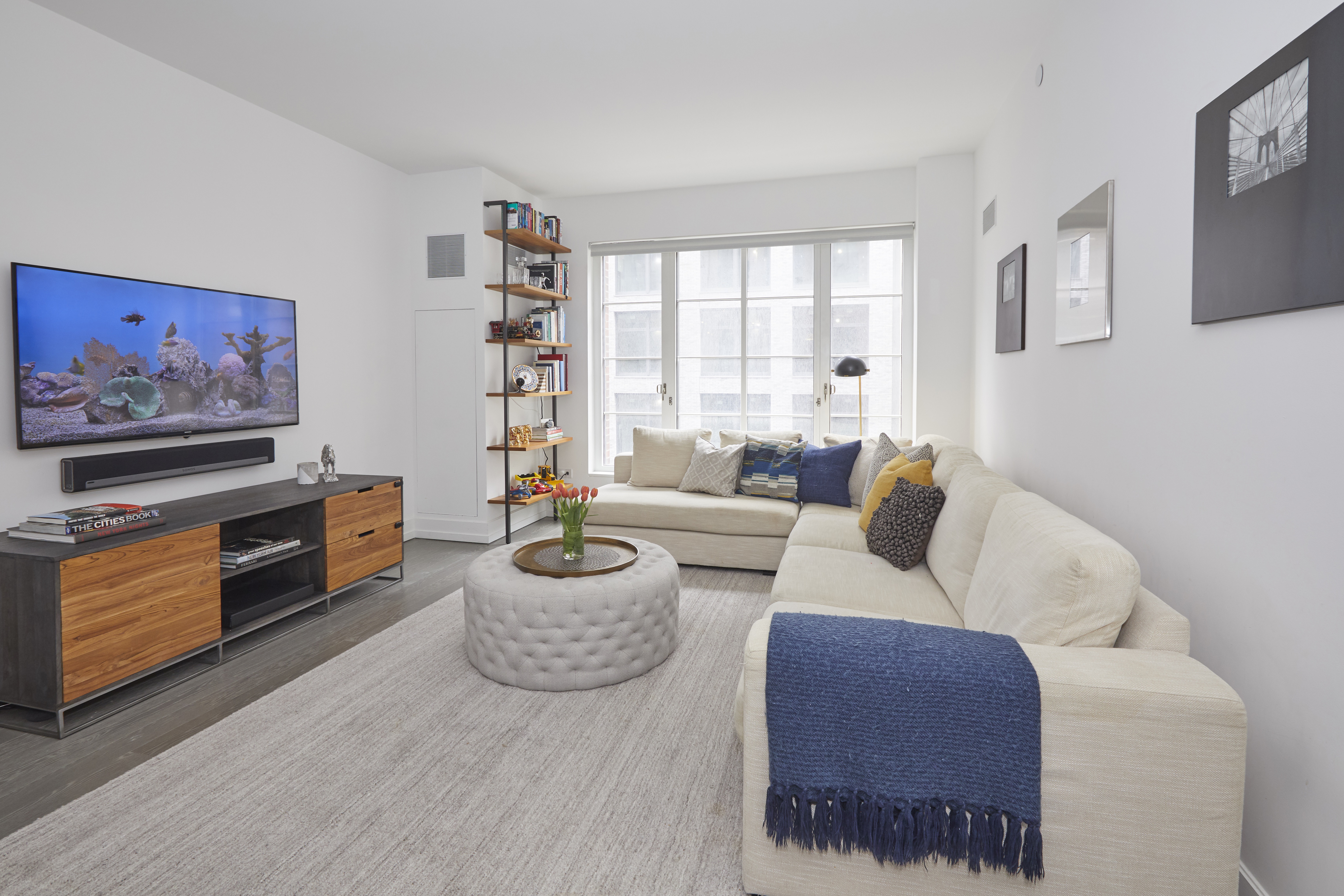 a living room with furniture and a flat screen tv