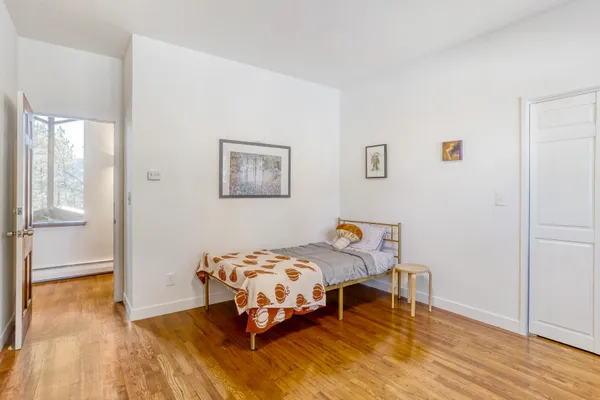 a view of a city with lush green forest