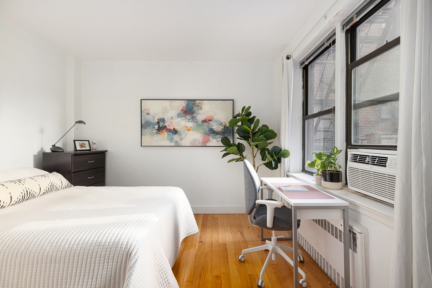 a bedroom with a bed and a table