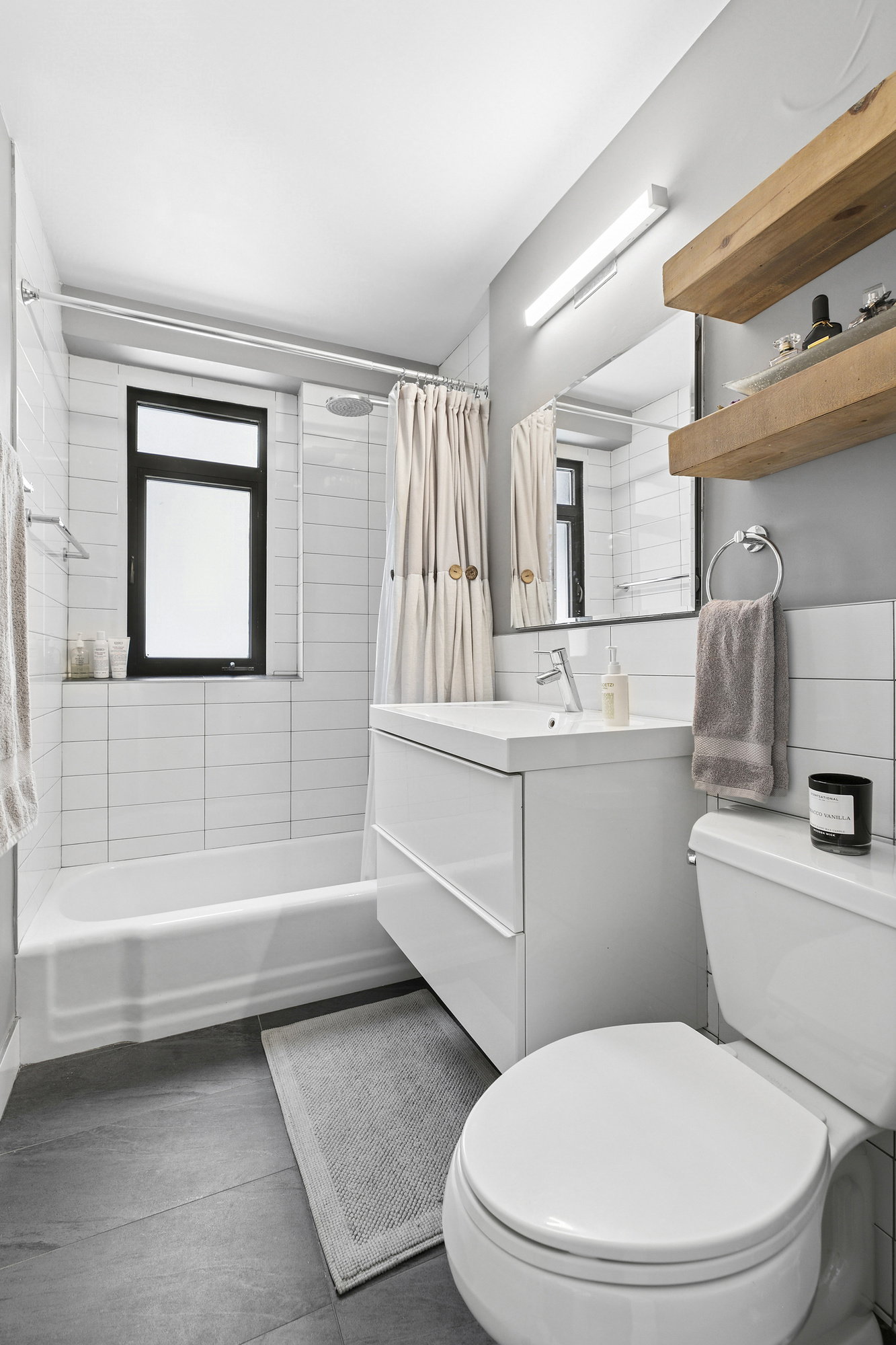 16 West 16th Street, Unit 3RN Manhattan, NY 10011 - Photo 5 of 9 a bathroom with a toilet a sink and bathtub