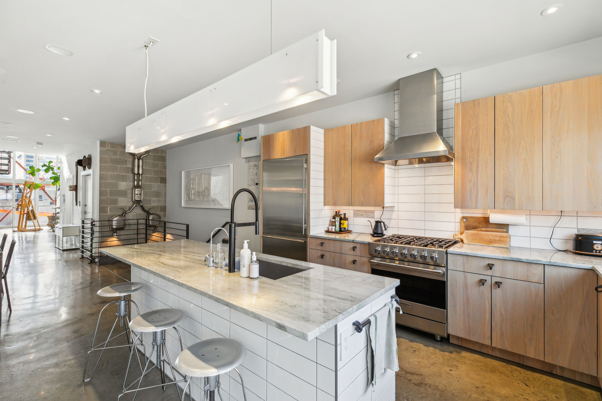 449 North 13th Street Philadelphia, PA 19123 - Photo 26 of 62 a kitchen with stainless steel appliances a sink stove and cabinets