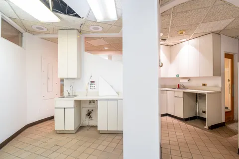 a view of a hallway with washer and dryer