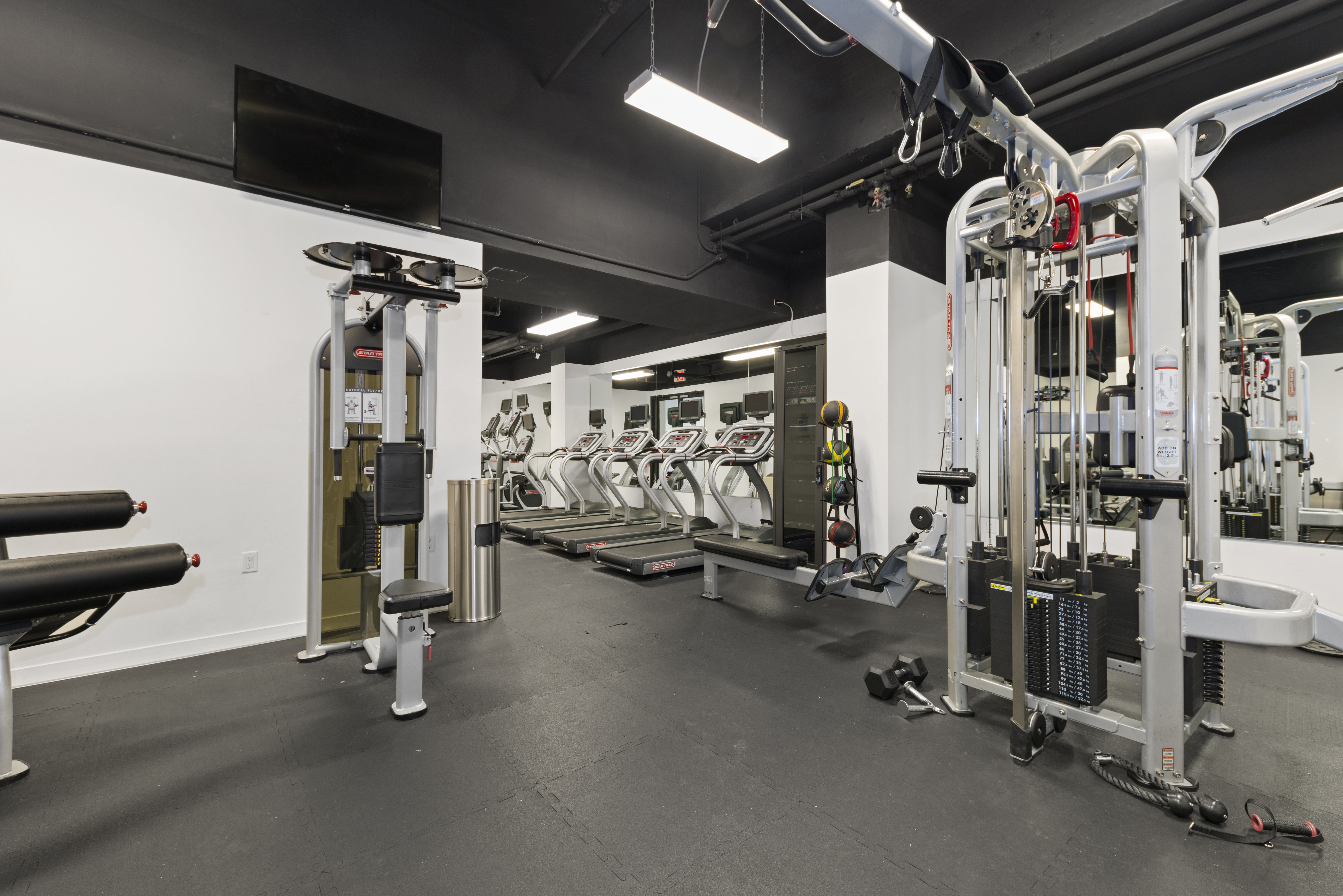 540 West 49th Street, Unit 609N Manhattan, NY 10019 - Photo 9 of 10 a view of a room with gym equipment