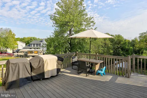 a view of a house with a yard patio and a slide