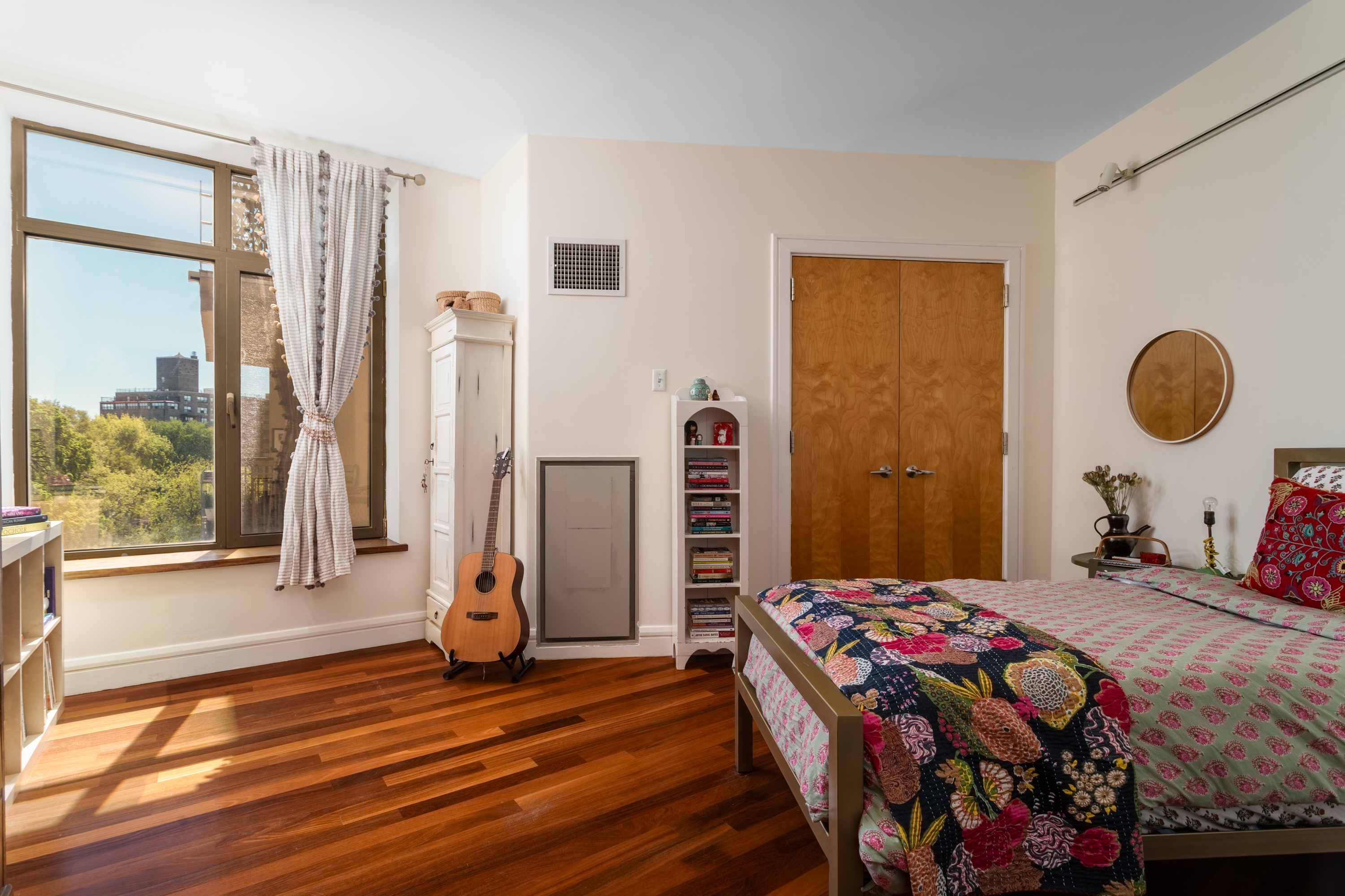 346 Coney Island Avenue, Unit 602 Brooklyn, NY 11218 - Photo 9 of 12 a bedroom with a bed and wooden floor