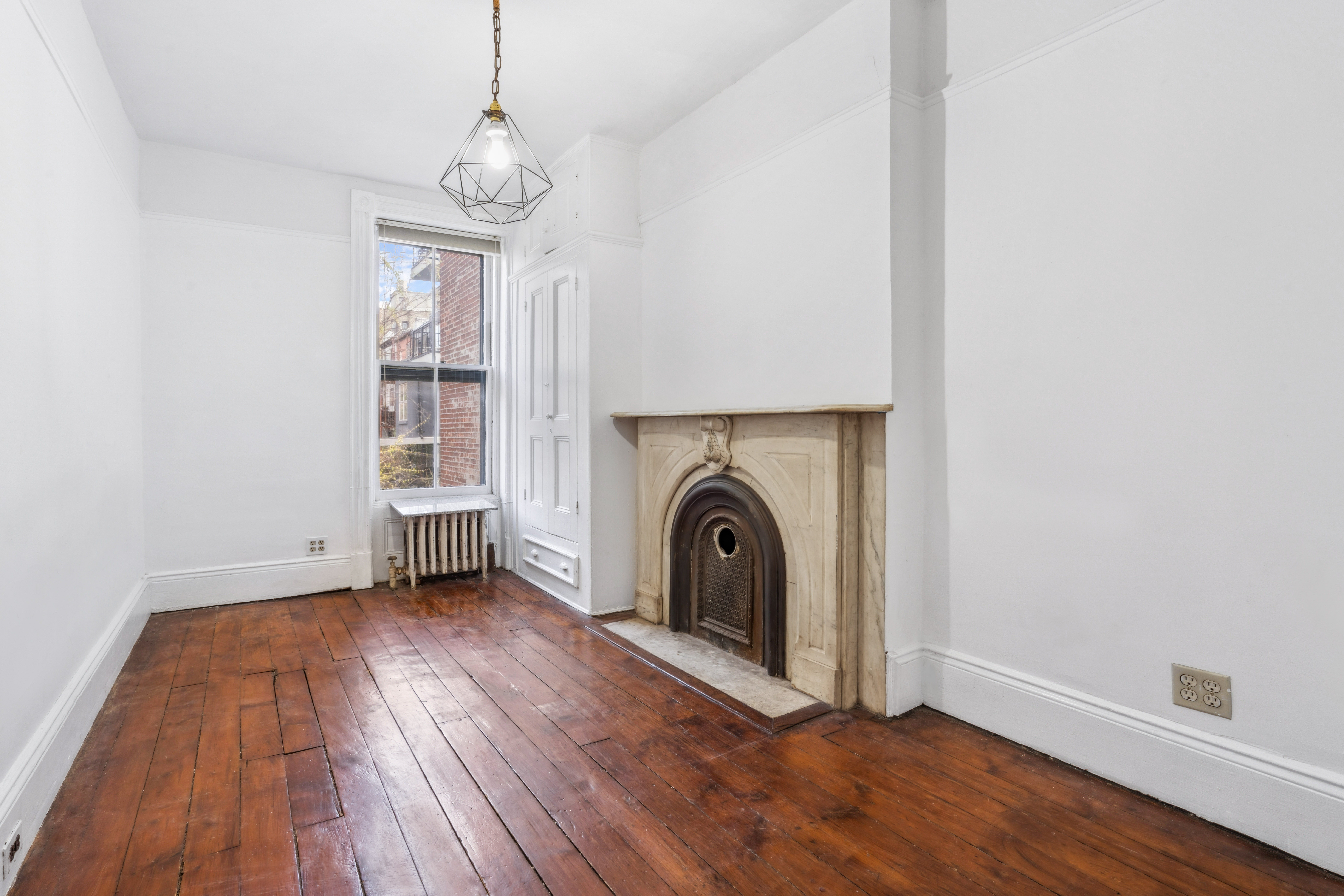 509 6th Avenue Brooklyn, NY 11215 - Photo 13 of 20 a view of a hallway with wooden floor and a window