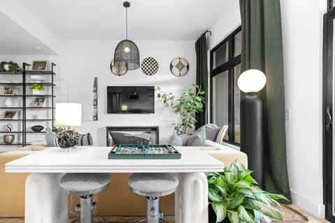 a kitchen with a table and chairs in it