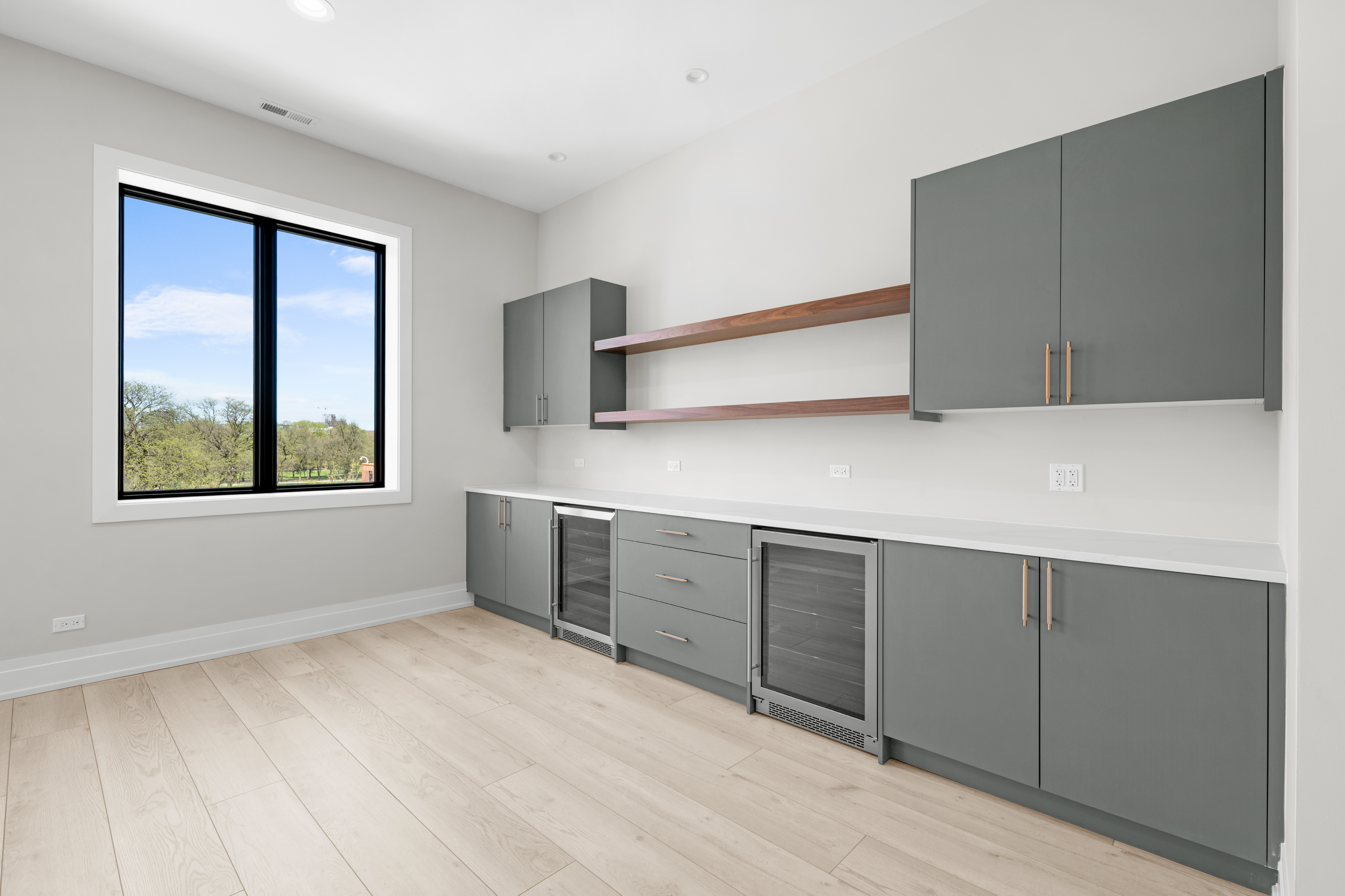 1327 West Taylor Street, Unit 4 Chicago, IL 60607 - Photo 7 of 27 a view of an empty room with window and cabinet