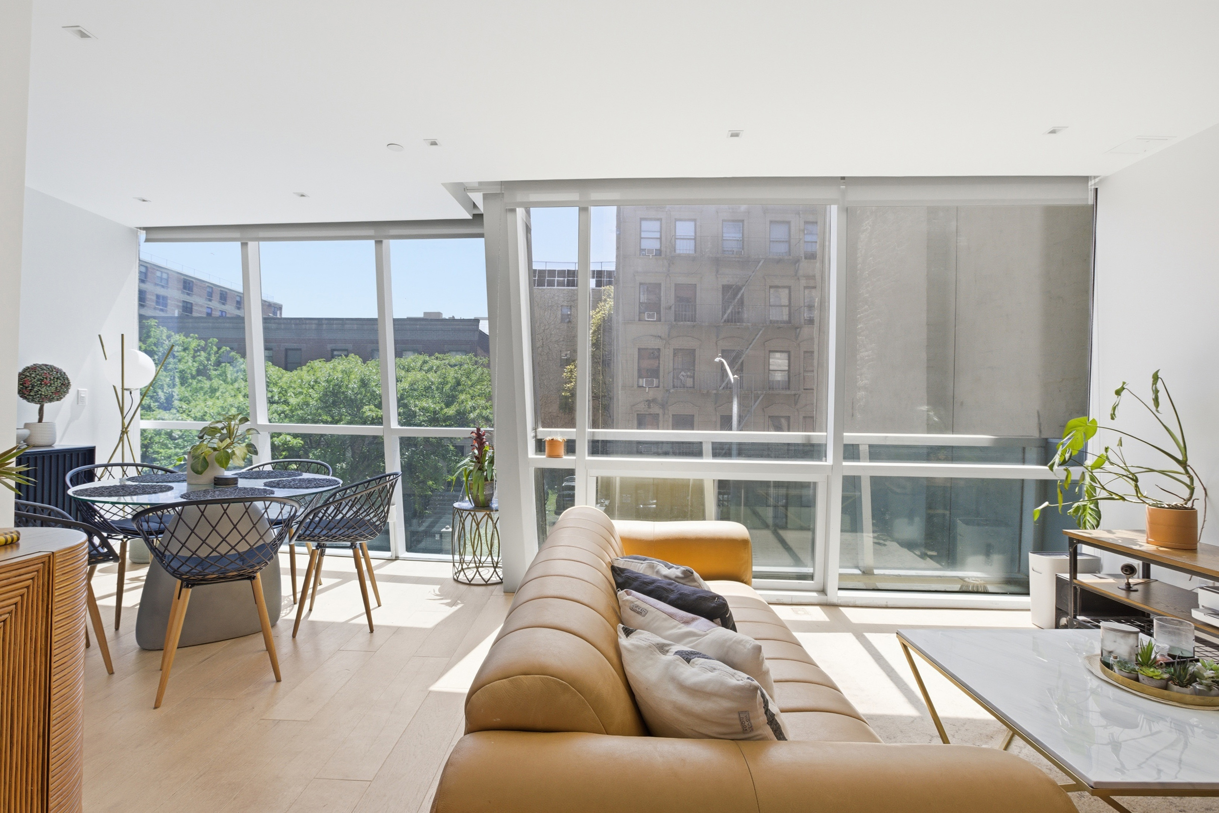 313 West 121st Street, Unit 2 Manhattan, NY 10027 - Photo 2 of 12 a living room with furniture and a large window