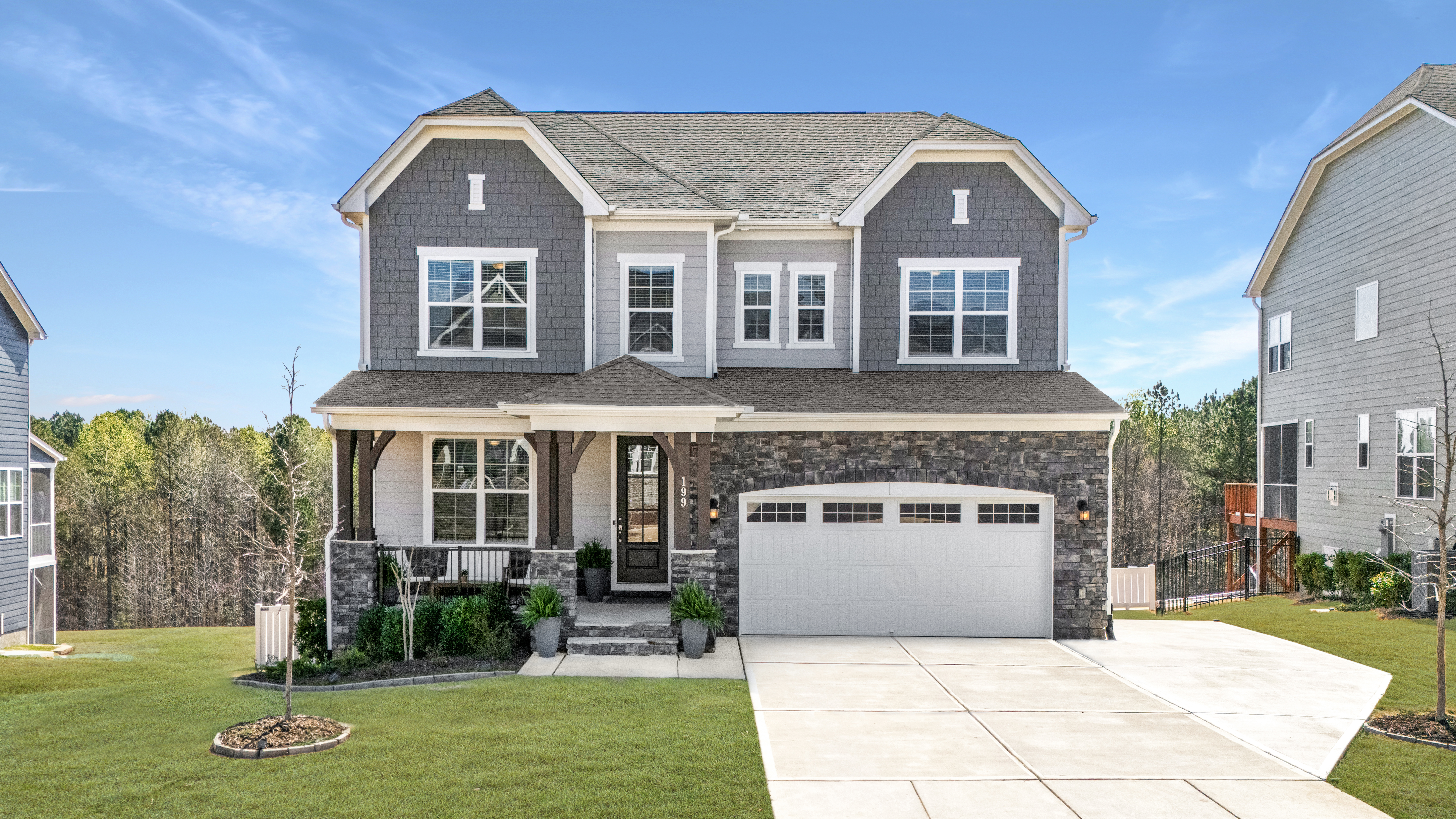a front view of a house with garden