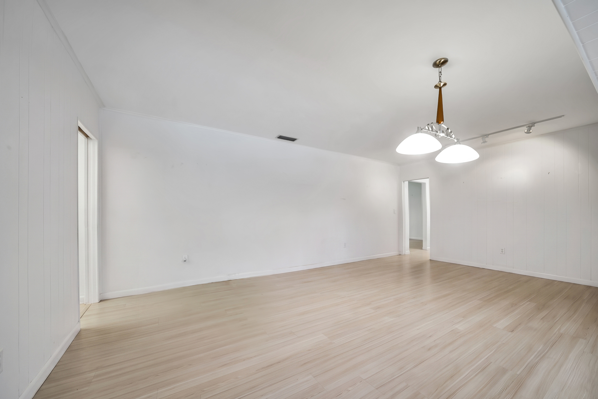 6760 Southwest 62nd Terrace Miami, FL 33143 - Photo 5 of 38 a view of an empty room with a chandelier fan