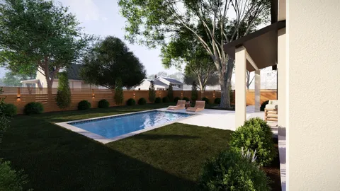 a view of swimming pool with seating area and trees around