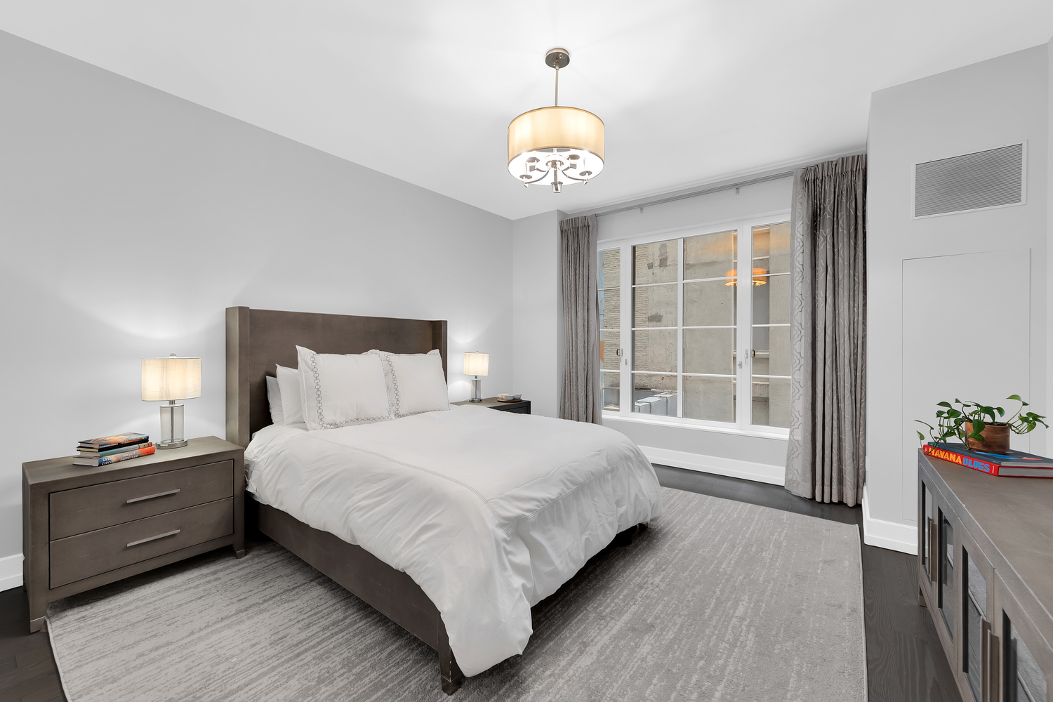 70 Charlton Street, Unit 3F Manhattan, NY 10014 - Photo 5 of 15 a bedroom with a bed and a large window