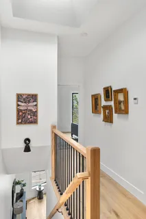 a bedroom with furniture and wooden floor