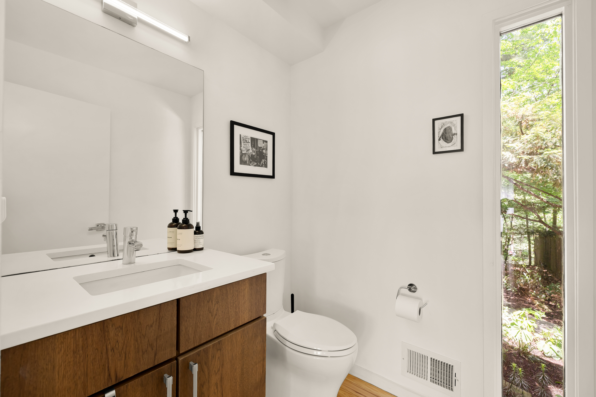 2710 Brandywine Street Northwest Washington, DC 20008 - Photo 44 of 74 a bathroom with a sink mirror and toilet