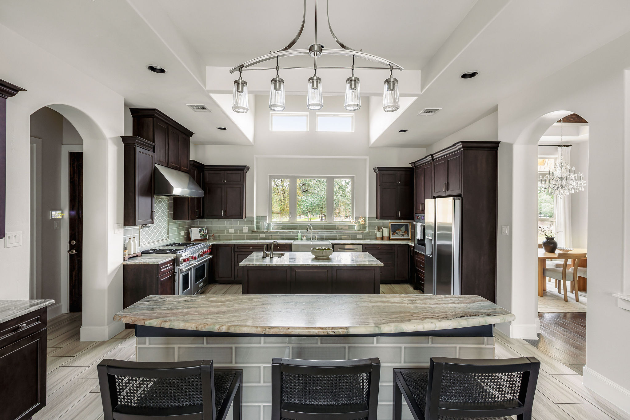 812 Jennings Branch Georgetown, TX 78633 - Photo 16 of 100 a kitchen with a table chairs and refrigerator