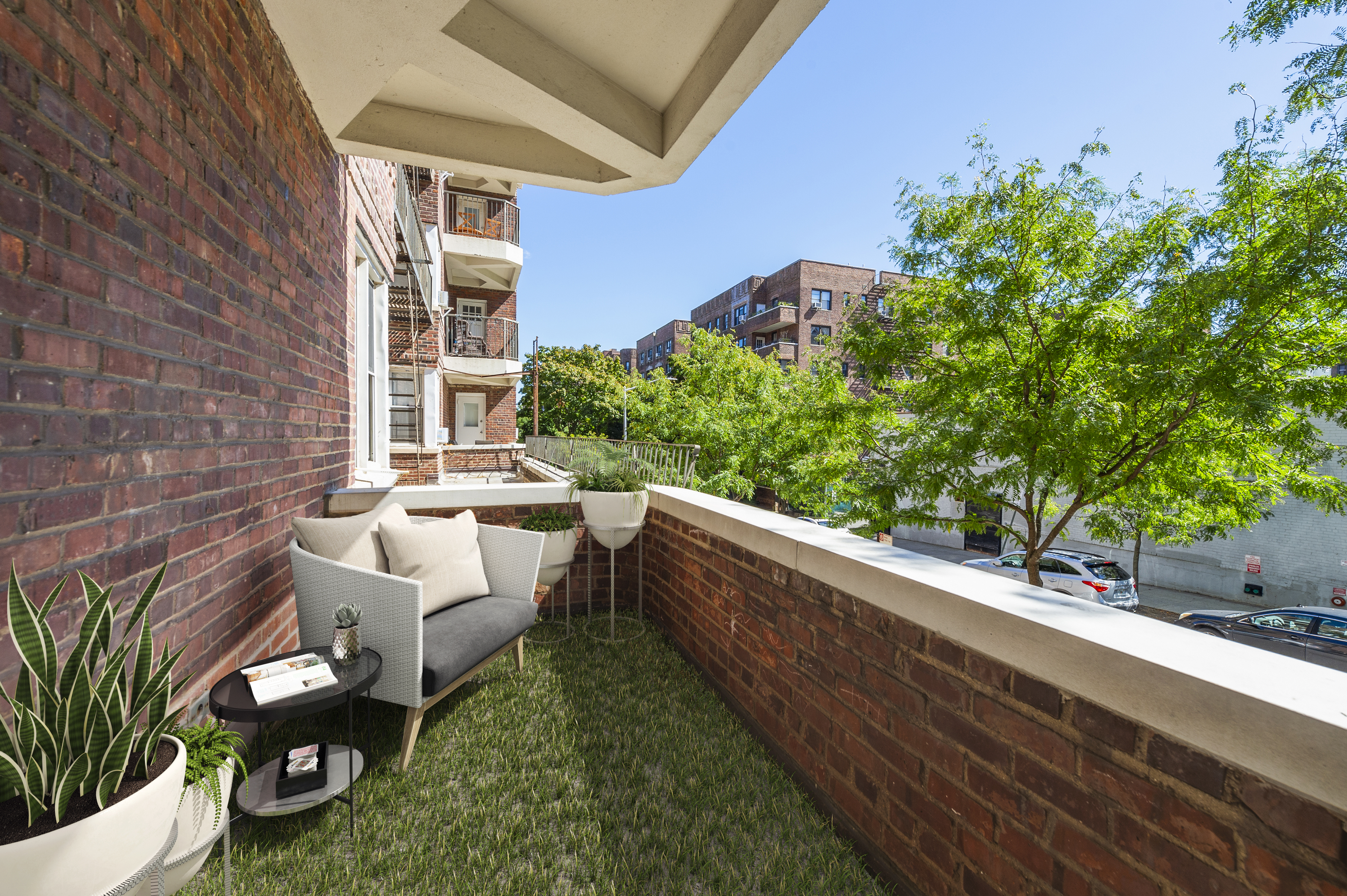 105-05 69th Avenue, Unit 301 Queens, NY 11375 - Photo 1 of 13 a view of a patio with couches and potted plants