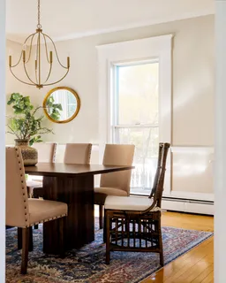 a living room with furniture a window and a table