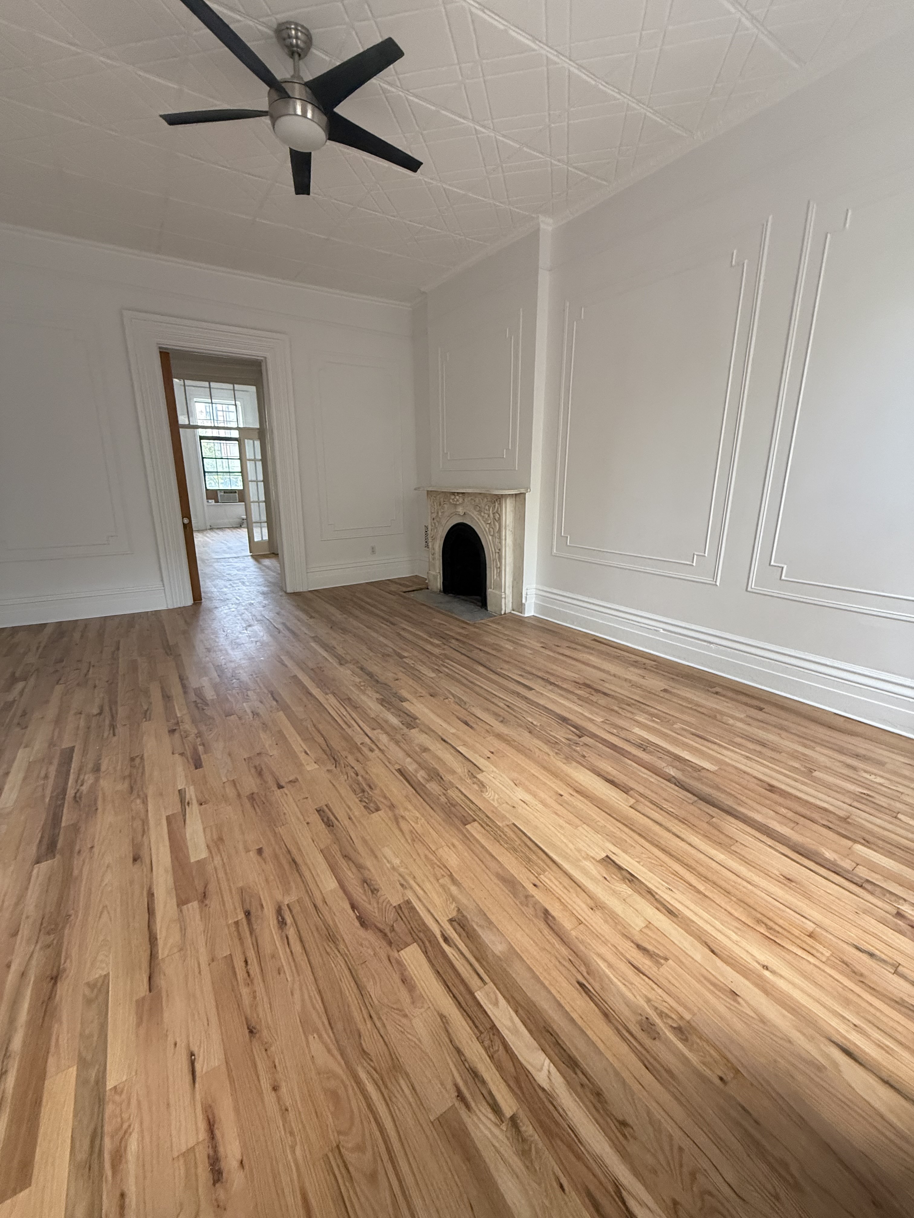 141 Summit Street, Unit 2 Brooklyn, NY 11231 - Photo 9 of 12 a view of an empty room and wooden floor