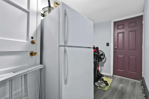 a utility room with closet dryer and washer