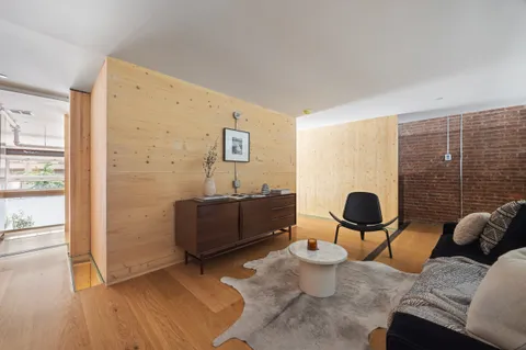 a bedroom with a bed and a table