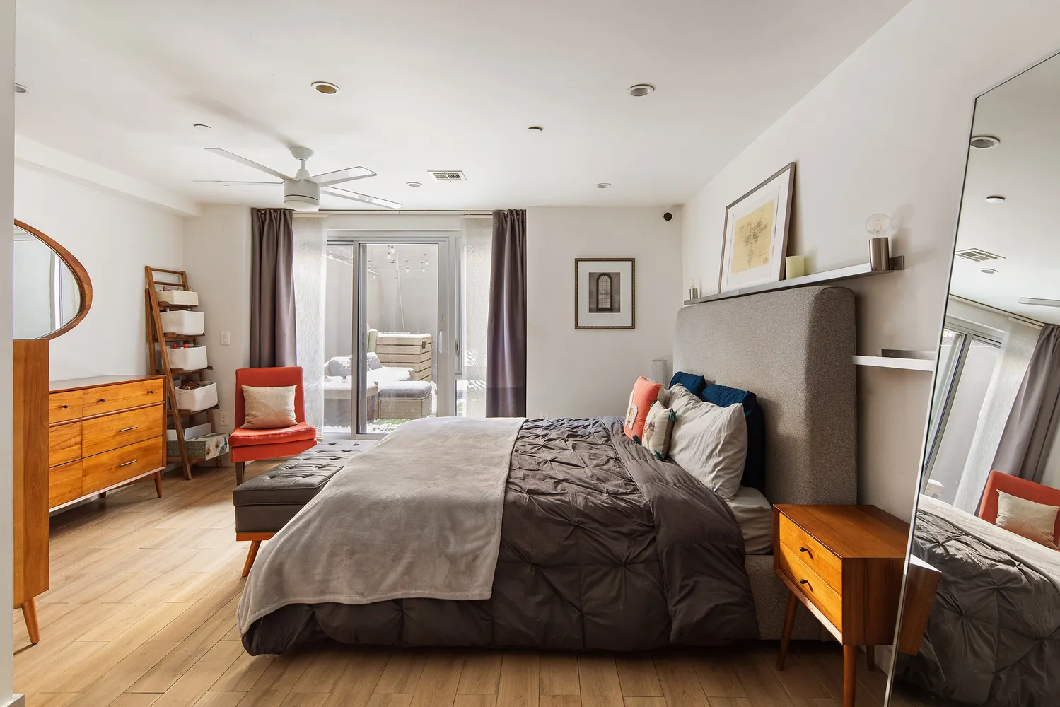 a bedroom with furniture and a window