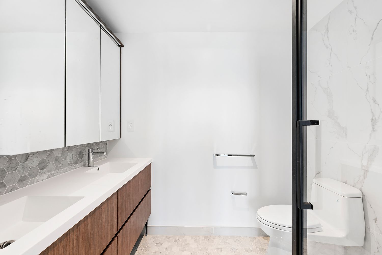 567 Ocean Avenue, Unit B504 Brooklyn, NY 11226 - Photo 6 of 8 a bathroom with a granite countertop sink toilet and shower