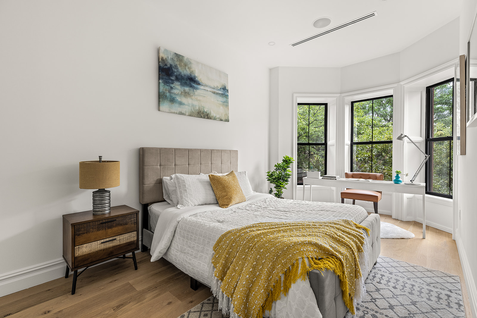 17 Linden Street Brooklyn, NY 11221 - Photo 10 of 19 a bedroom with a bed and wooden floor