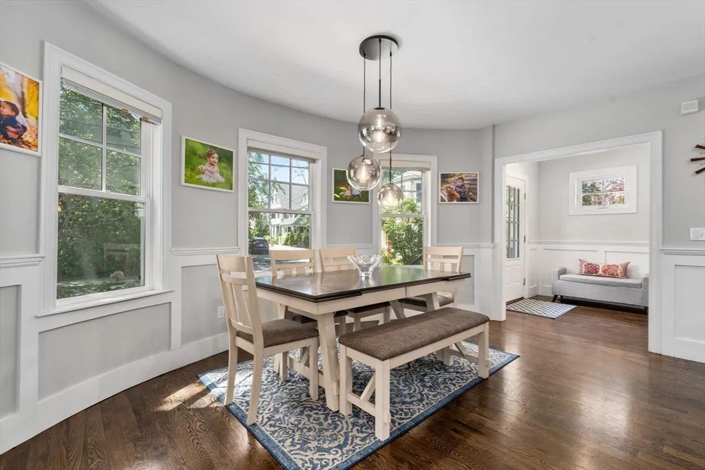 a living room with furniture a window and a table