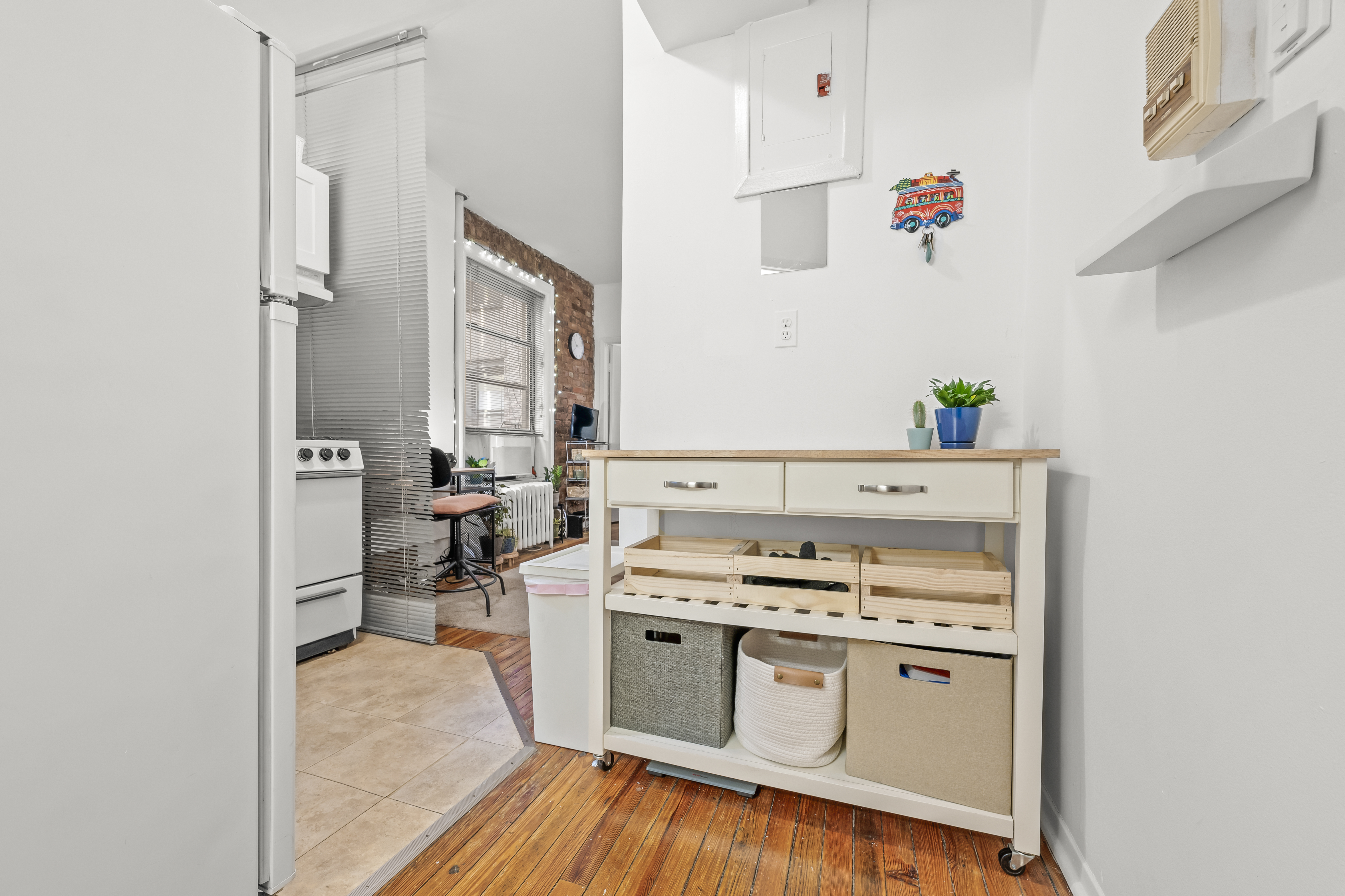 204 West 10th Street, Unit 7A Manhattan, NY 10014 - Photo 9 of 17 a kitchen with stainless steel appliances a stove and a refrigerator