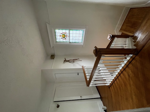 340 Marlborough Road Brooklyn, NY 11226 - Photo 21 of 27 a view of staircase with white walls and a window