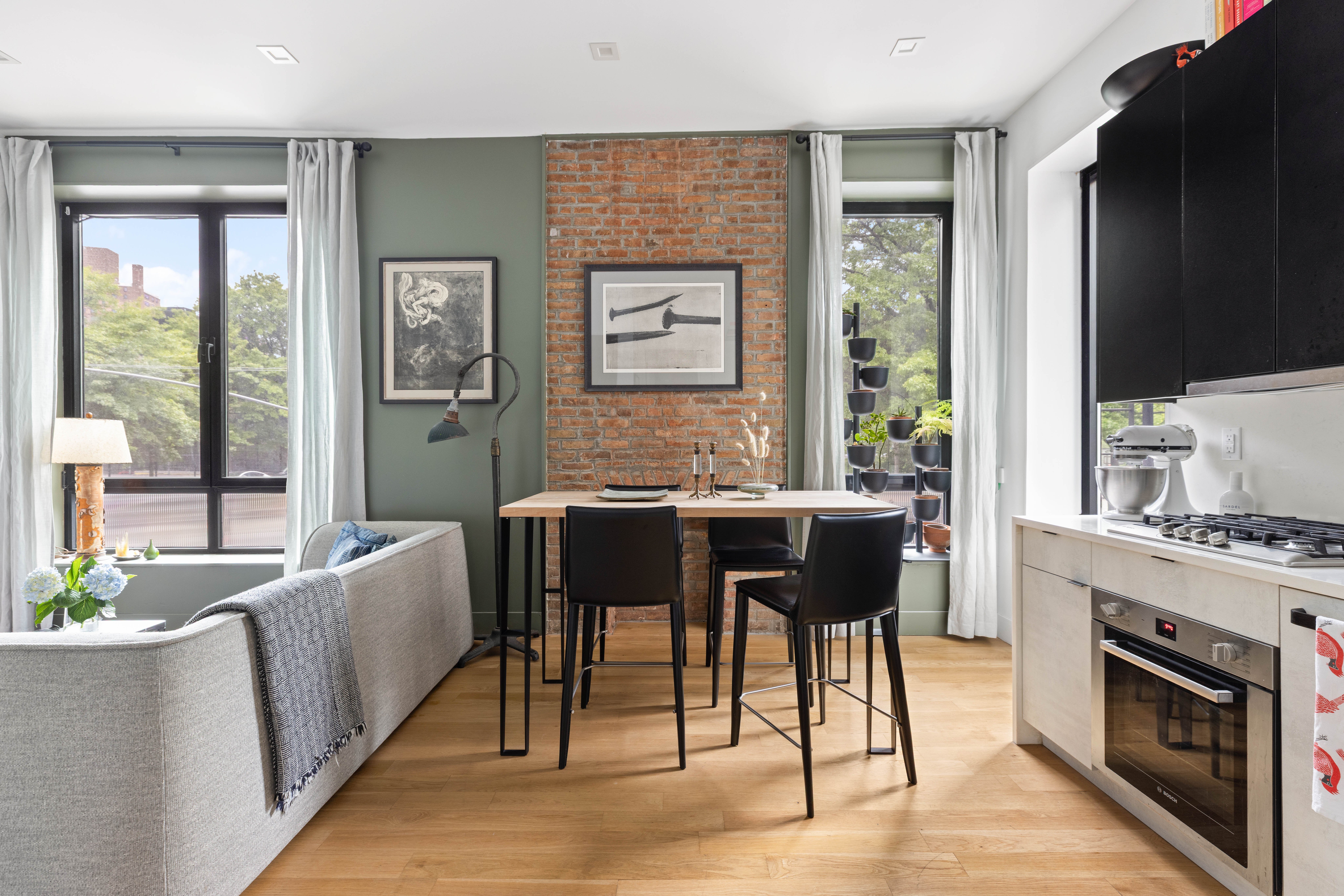 315 South 5th Street, Unit 2 Brooklyn, NY 11211 - Photo 4 of 10 a view of a dining room with furniture window and wooden floor