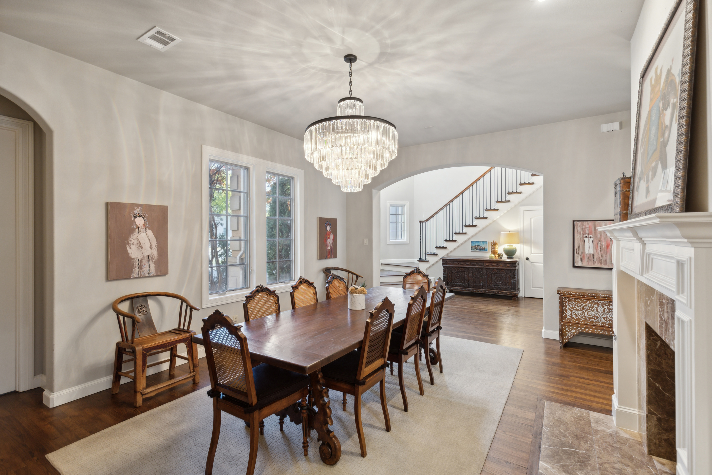 8411 Midway Road Dallas, TX 75209 - Photo 5 of 29 a view of a dining room with furniture and chandelier