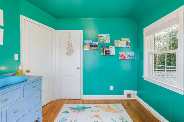 a room with window and cabinet