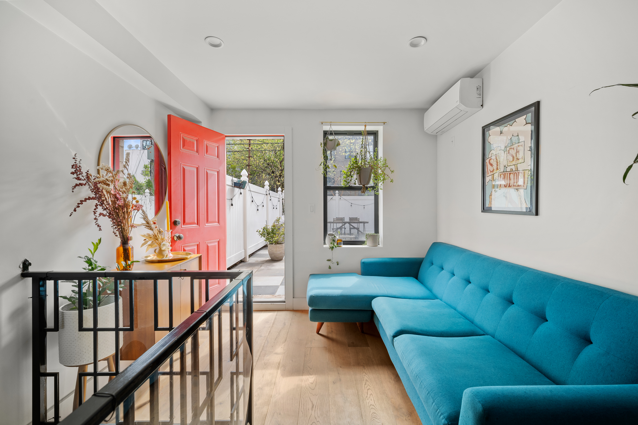 158 15th Street, Unit 1B Brooklyn, NY 11215 - Photo 2 of 14 a living room with furniture and a large window