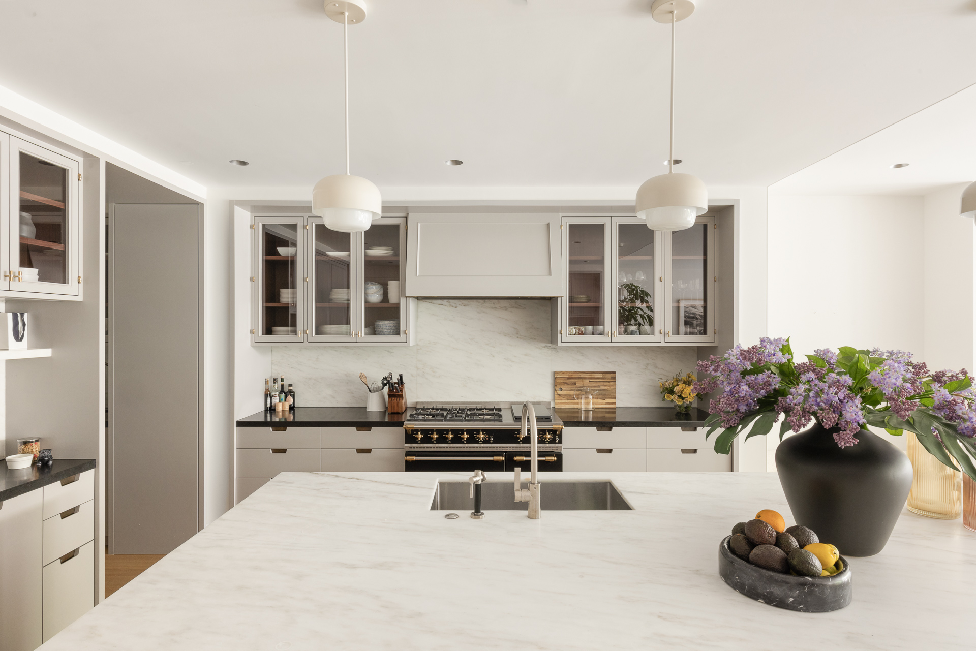 334 West 20th Street Manhattan, NY 10011 - Photo 8 of 20 a kitchen with a sink and lots of white cabinets