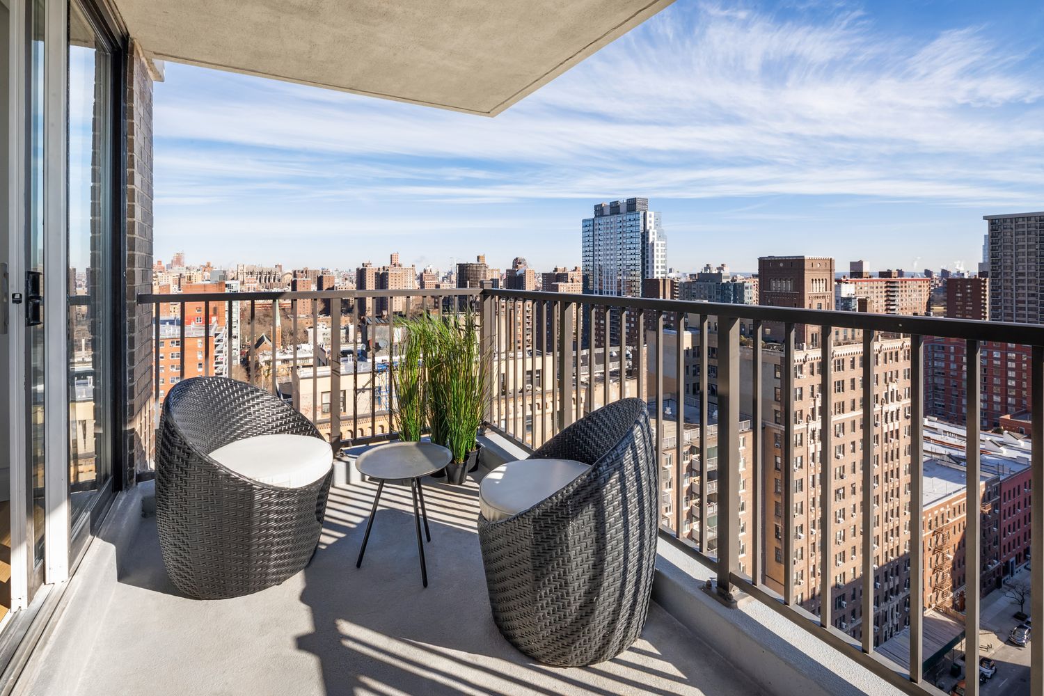 a balcony with furniture and a roof